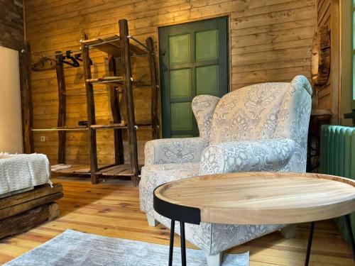 a living room with a couch and a table at Villa Adis with Hot Pool & Jacuzzi by BookVillaBG in Borovets