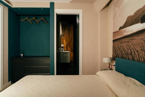 Postel nebo postele na pokoji v ubytování Guest house i giardini di Bados