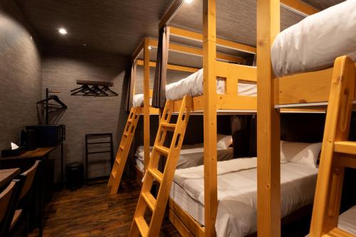 a bunk bed room with two bunk beds in it at OLD HERITAGE SHIBUYA in Tokyo