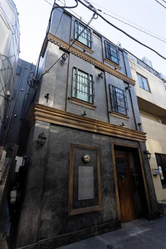 a building with a door on the side of it at OLD HERITAGE SHIBUYA in Tokyo