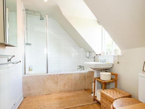 a bathroom with a shower and a sink and a tub at 5 Bed in Sturminster Newton 76458 in Lydlinch