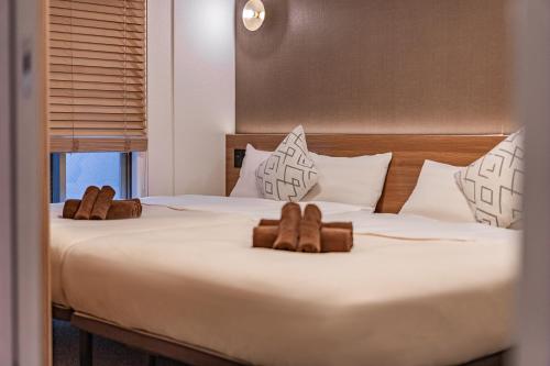 Postel nebo postele na pokoji v ubytování Apartment Hotel 11 Shinsaibashi