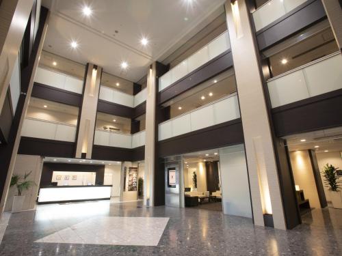 a lobby of a building with a large building at X wave Funabashi in Funabashi