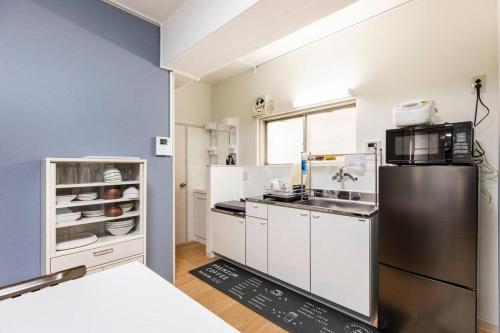 Кухня или кухненски бокс в G&R House 202　Shinjuku room