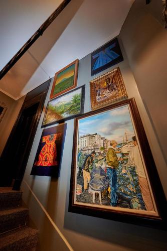 a group of paintings hanging on a wall at Faik Pasha Hotels Special Category Beyoglu Istanbul in Istanbul