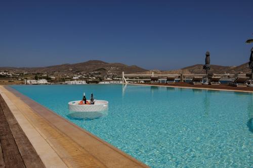 a boat in a large pool of blue water at Maryo Village in Naousa