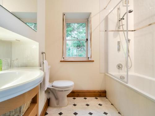 a bathroom with a sink toilet and a shower at 1 Bed in Borrowdale SZ163 in Keswick
