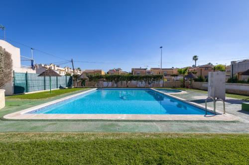 a swimming pool in the middle of a yard at Blue Lagoon by Fidalsa in Torrevieja