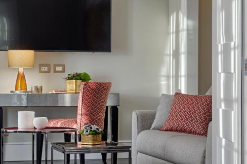 a living room with a couch and a table at Hilton Molino Stucky Venice in Venice
