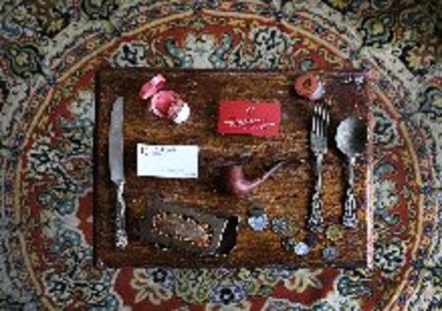 a table with utensils on top of a table at Casa Falleri Boutique Hotel in Lima