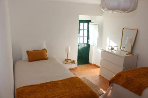 Ένα ή περισσότερα κρεβάτια σε δωμάτιο στο Casa do Riu