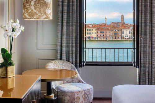 a hotel room with a view of the water at Hilton Molino Stucky Venice in Venice
