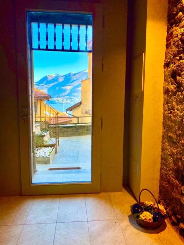 an open door with a view of a courtyard at Casa Spasù in San Bartolomeo