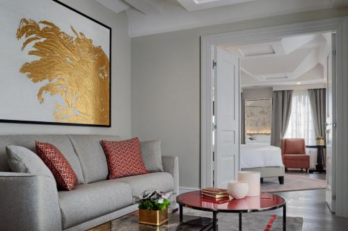 a living room with a couch and a table at Hilton Molino Stucky Venice in Venice