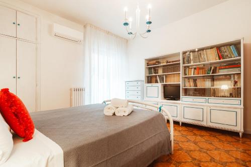 a bedroom with a bed with two towels on it at Center Apartament-Housea Travel in Polignano a Mare
