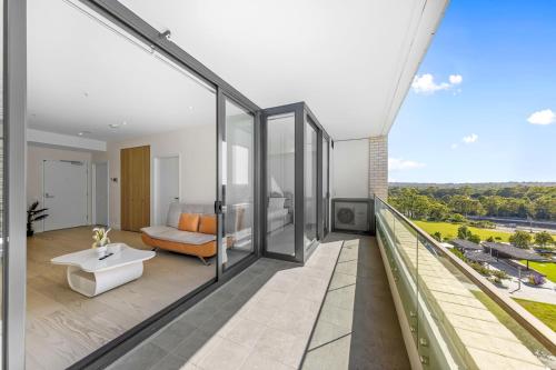 a view from the balcony of a house at Executive Two-Bedroom Apartment in Macquarie Park in Sydney