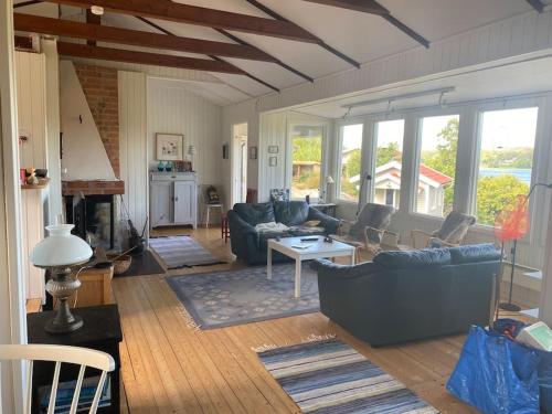 a living room with couches and a fireplace at Klostergården 