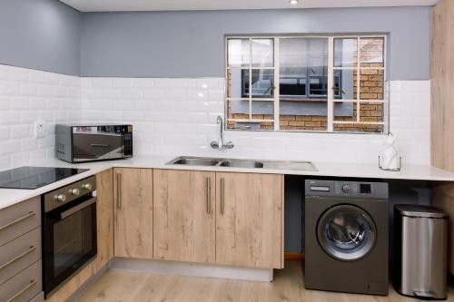 Kuchyň nebo kuchyňský kout v ubytování Uptown Apartments - Casalinga Villas