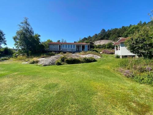 a house on top of a hill with a yard at Klostergården 