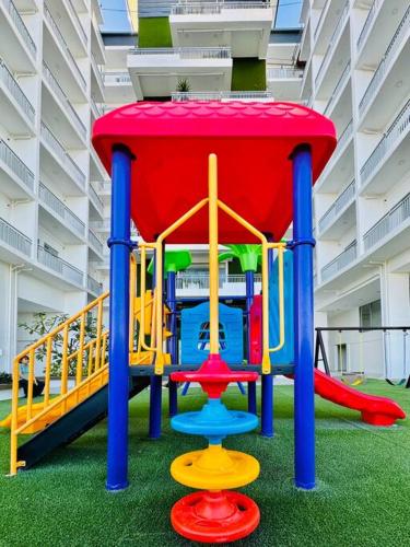 a playground in a mall with a colorful play structure at * * WV 3 Peaceful Pinnacle in Iloilo City