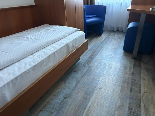 Ένα ή περισσότερα κρεβάτια σε δωμάτιο στο Hotel Fackelmann