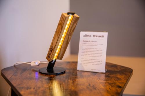 a lighted saxophone on a table next to a sign at Park Hotel Bellavista in Gambarie dʼAspromonte