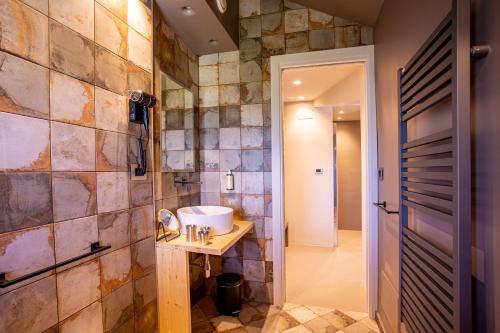 a bathroom with a sink and a mirror at Park Hotel Bellavista in Gambarie dʼAspromonte