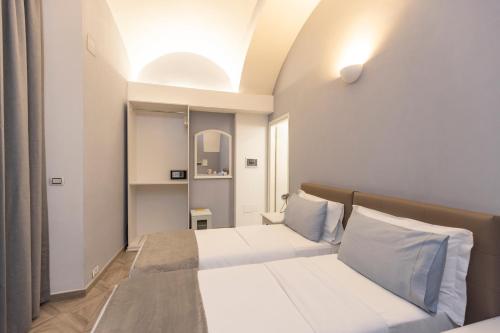 トリノにあるDomus Taurinorumの部屋にベッドが2つある寝室
