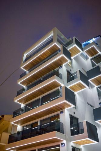 a building with a geometric facade at night at SIGMA Suites Hotel in Thessaloniki