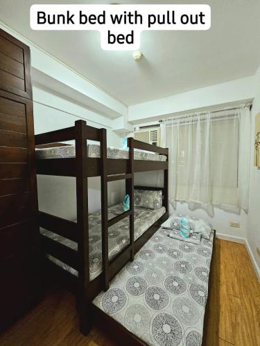 a bedroom with two bunk beds withpull out bed at Camella Northpoint Bajada Near Sm lanang 2bedroom unit with balcony Davao in Davao City