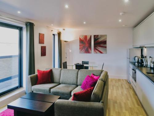 a living room with a couch and a table at Your Space Apartments - Eden House in Cambridge