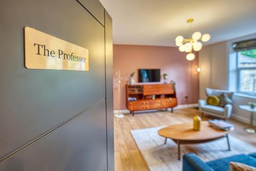 a living room with a couch and a table at Haworth Heights - An AMAZING Aparthotel! in Haworth