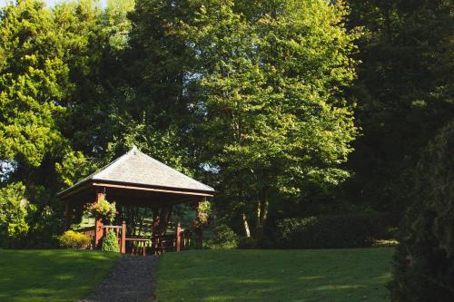 a gazebo in the middle of a green field at Briery Wood Hotel in Ambleside