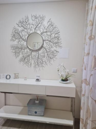 a bathroom with a mirror on the wall at Retiro da perreira com churrasqueira in Vila Nova de Paiva