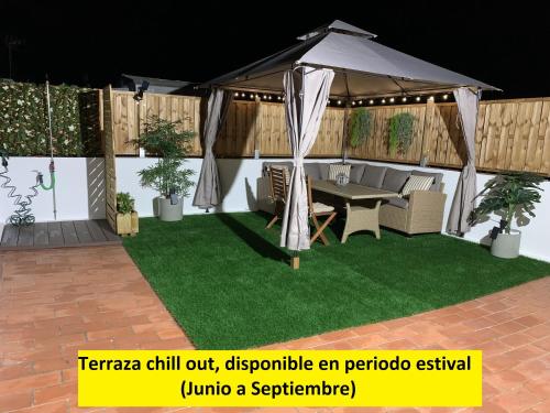 a tentilla chill outdiscrete an patio extravaganza at Apartamento Sotavento Chipiona in Chipiona