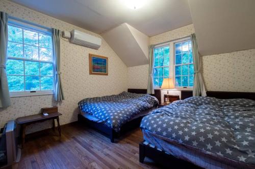 Ένα ή περισσότερα κρεβάτια σε δωμάτιο στο Private hot-spring Villa in Nasu