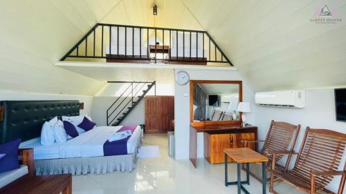 a bedroom with a bed and a balcony at Almost Heaven in Talawakele
