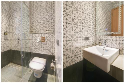 a bathroom with a toilet and a sink at Hotel Bluestone Nehru Place by The Cosy Hotels in New Delhi
