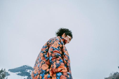 a man wearing a jacket with a flower pattern at kerii - adults boutique hotel in Saalbach Hinterglemm