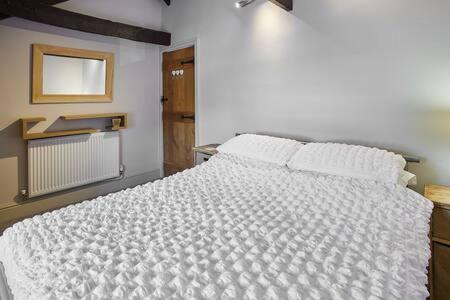 a bedroom with a white bed in a room at Host & Stay - Mill in Consett