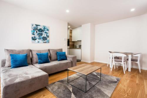 a living room with a couch and a table at Vip Casa Club Zlatibor in Zlatibor