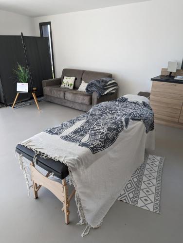 Ein Bett oder Betten in einem Zimmer der Unterkunft Studio indépendant vue magnifique et au calme