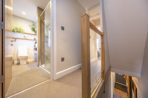a hallway with a glass door in a house at 40 Parsonage Street in Cambridge