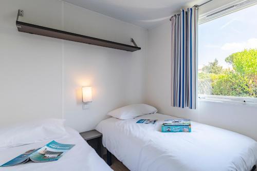 Cama o camas de una habitación en Azureva Fouras