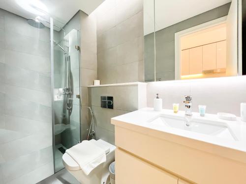 a bathroom with a sink and a shower at Luxury Studio with Unobstructed Burj Khalifa View - 23AB08 in Dubai