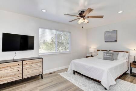 a bedroom with a bed and a flat screen tv at New Listing Country Property Pet Friendly W&D in Loomis