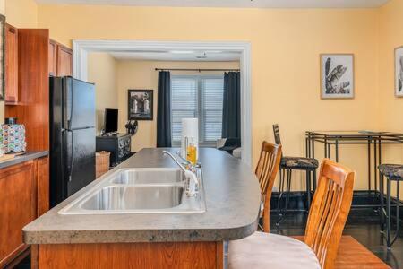 a kitchen with a sink and a counter top at Spacious upstairs 1bed- Walking distance to Beach outlet mall in Michigan City