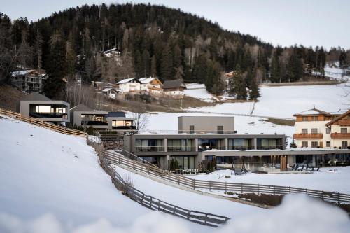 a resort in the snow on a mountain at Hotel Viertler in Avelengo