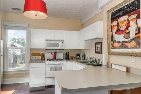 a kitchen with a santa clause picture on the wall at Studio w King Bed Walking distance to Beach & Shops in Michigan City