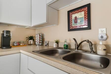 a kitchen with a stainless steel kitchen sink at Studio w King Bed Walking distance to Beach & Shops in Michigan City